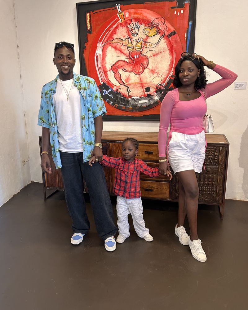 Victor, his wife and their daughter in an art gallery