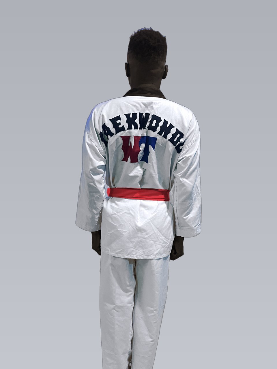 Victor from behind in his uniform and red belt